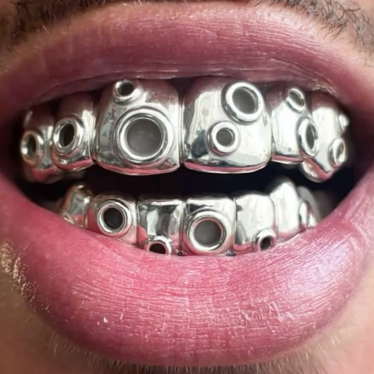 Design concept: grillz with raised circular settings across each tooth